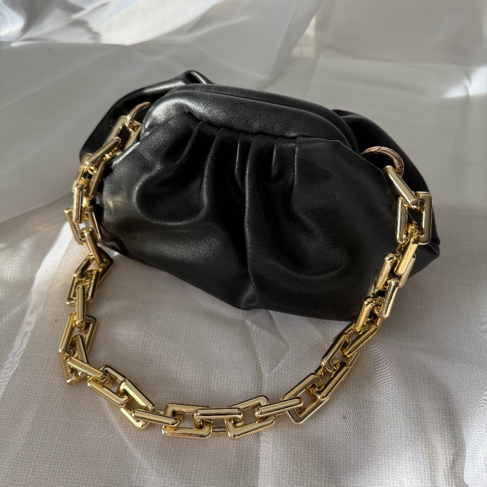 Black shoulder bag with gold chain